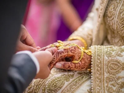 find a good Muslim husband, Close-up of a Muslim groom placing a gold marriage ring on his bride's finger during a traditional Nikkah ceremony.