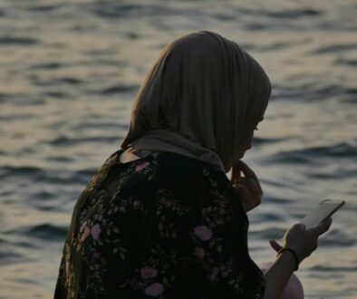 Salams app alternative UK - Muslim woman comparing halal marriage apps on her phone